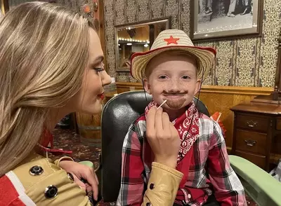 Kid getting a makeover at Dolly Parton's Stampede