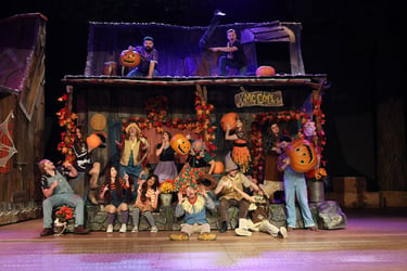 Hatfield and McCoys on the porch, holding jack-o-lanterns and dressed for Fall, already feudin'