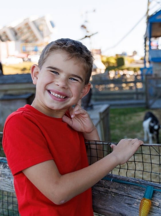 young guest outside enjoying preshow entertainment