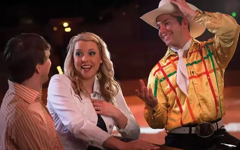 couple talking to performer at Dolly Parton's Stampede