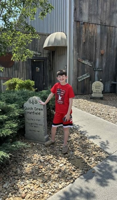 exterior image of young guest in red shirt