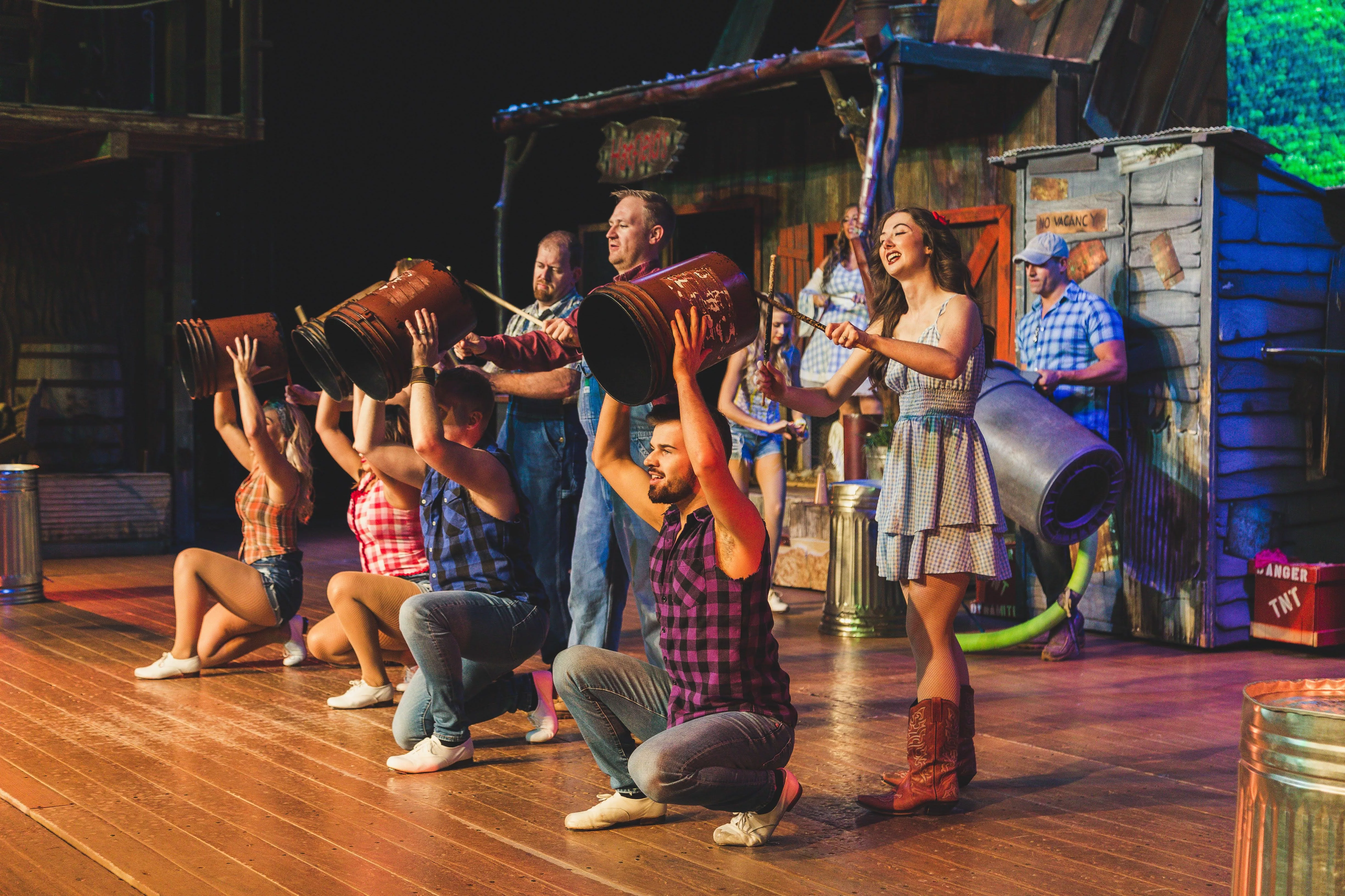 cast members playing musical intstruments