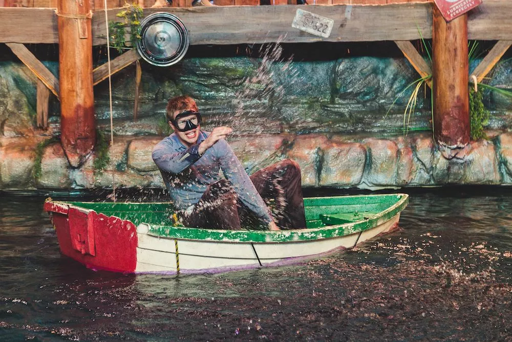 man in a boat at Hatfield's swimming hole