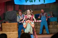 girl and boy fighting during Christmas show