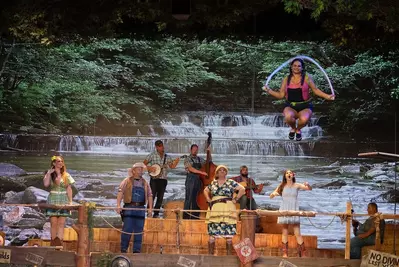 performer diving into the swimming hole with a jumprope