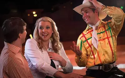 couple talking to performer at Dolly Parton's Stampede